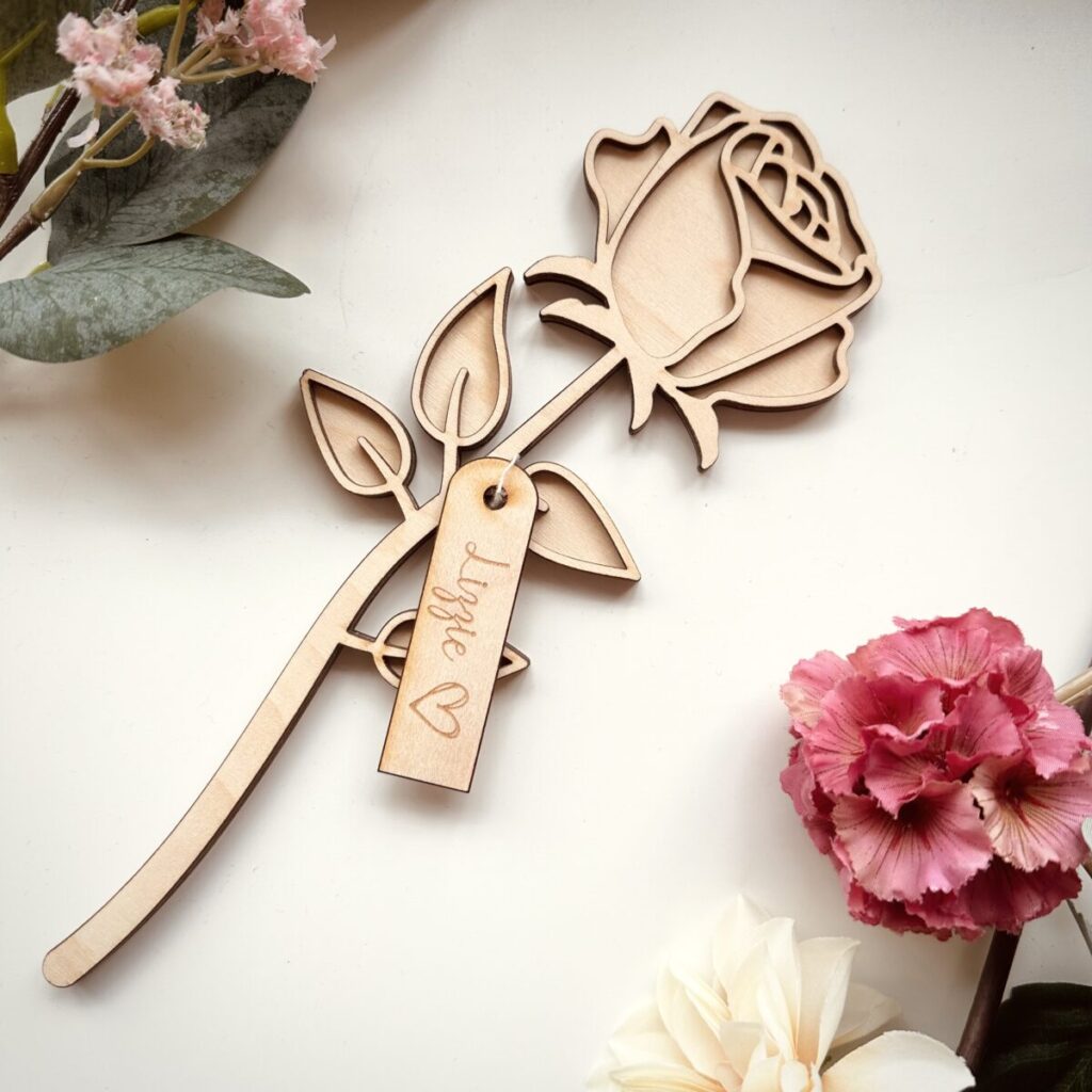 Laser-cut wooden rose with a personalised engraved wooden tag