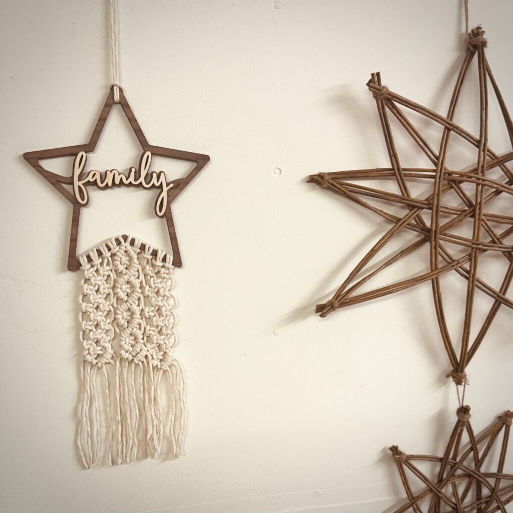 Laser-cut wooden frame with the word "Family" adorned with handknotted macrame
