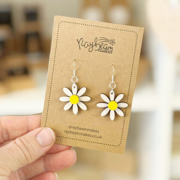 Hand-painted wooden daisy earrings with cerise pink petals and white centre
