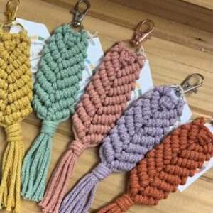 DIY macramé key ring kit with cords, 5 silver metal hooks, and instruction booklet; make 5 keyrings in custom colours, beginner-friendly, eco-conscious.